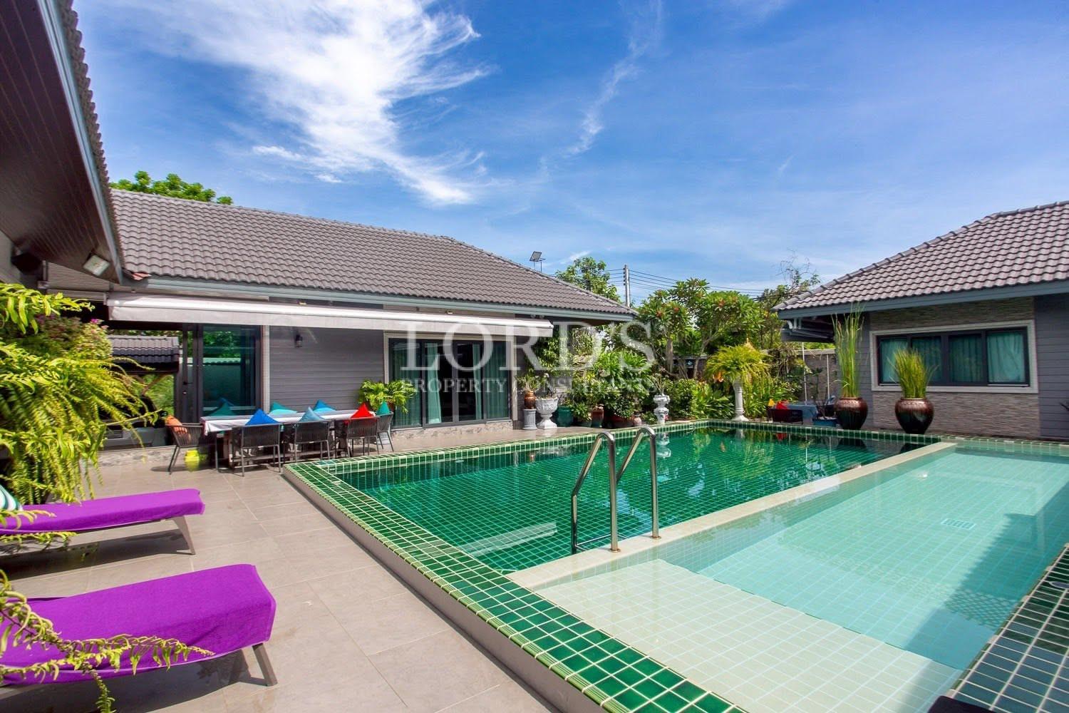 Courtyard swimming pool with villa surroundings