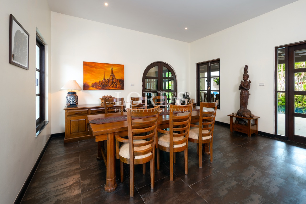 Formal dining room with long wooden table