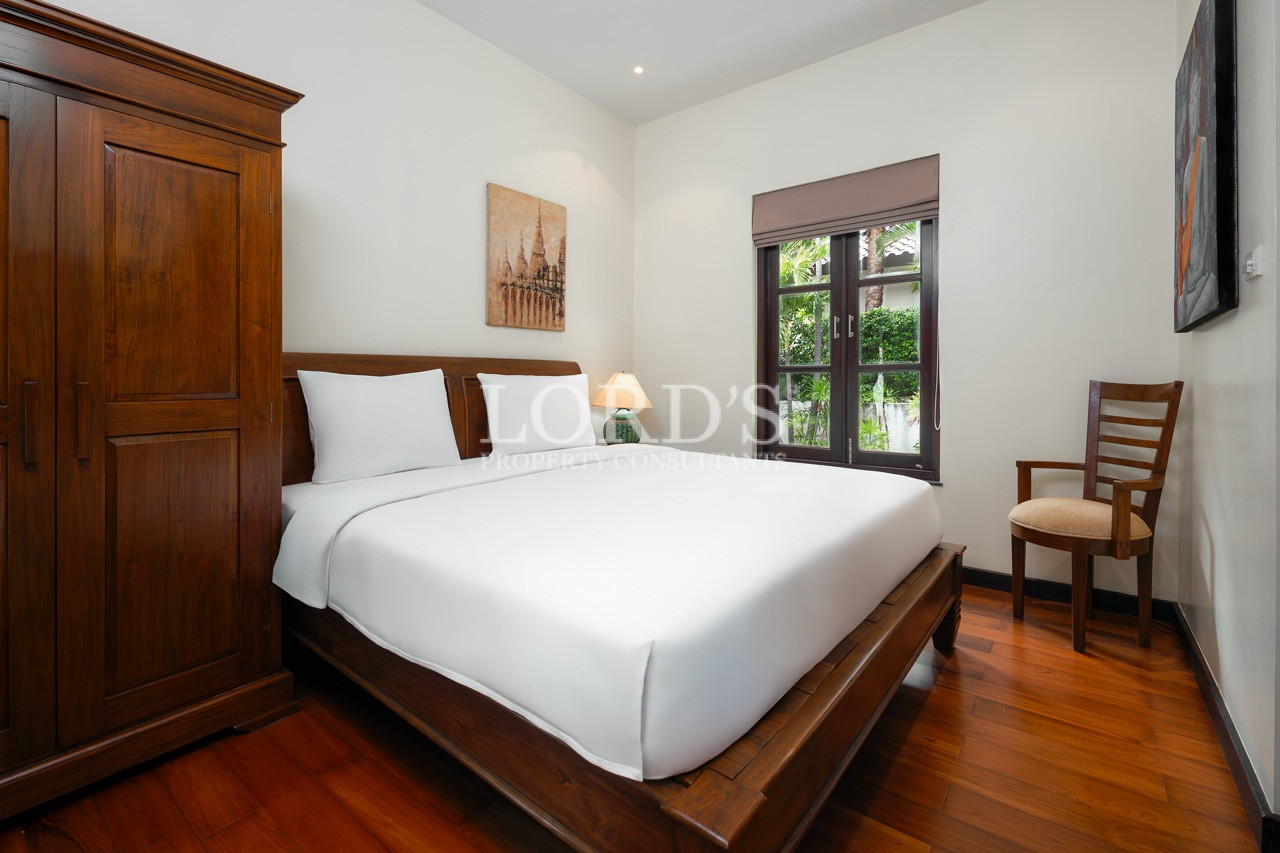 Bright bedroom with wooden bed frame