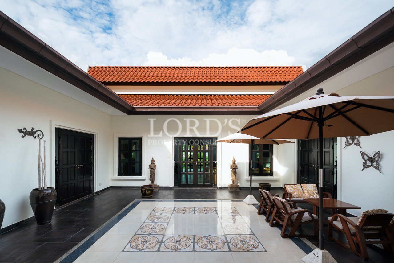 Villa entrance courtyard with covered walkway