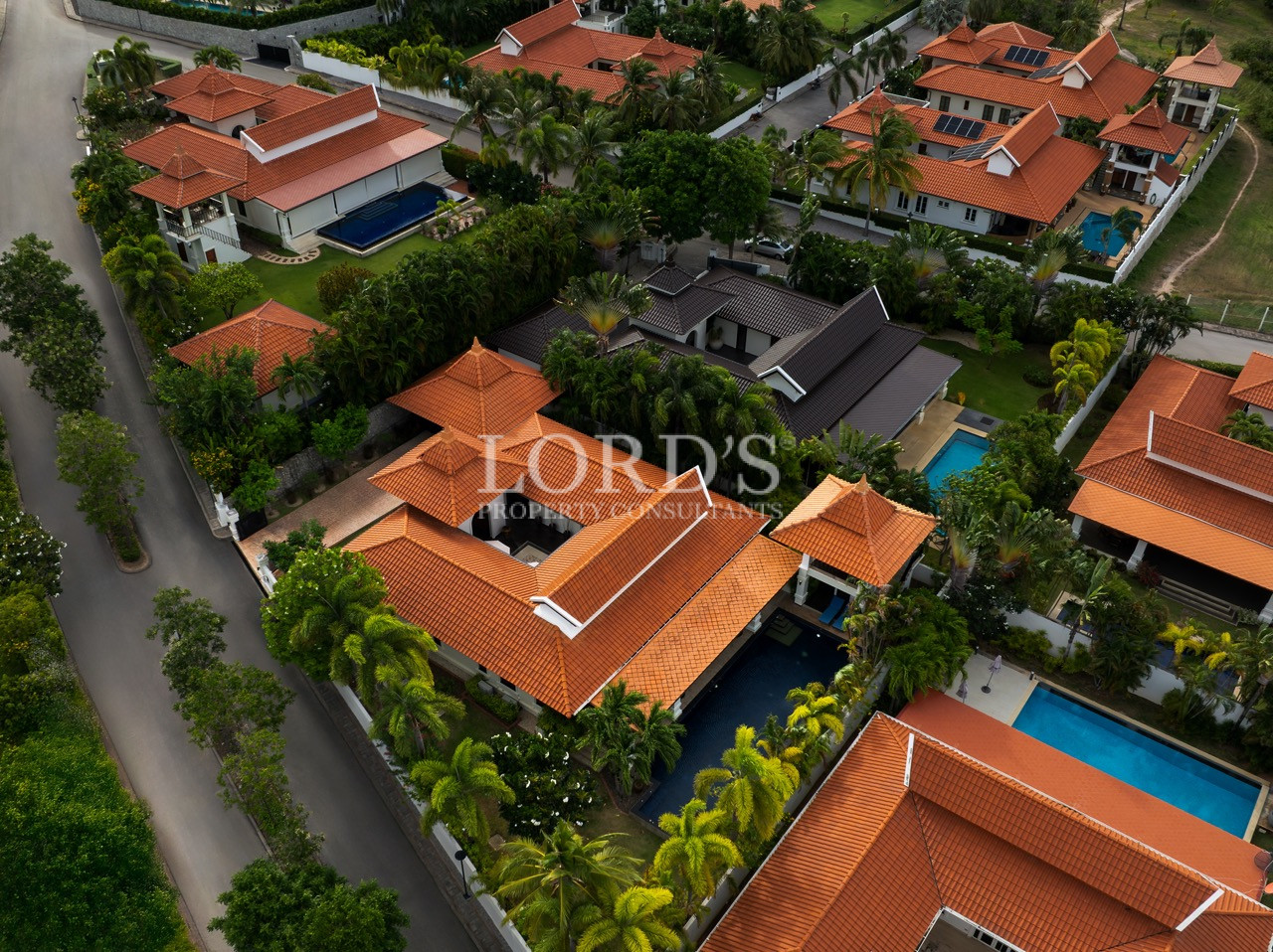 Aerial view of luxury villas and gardens