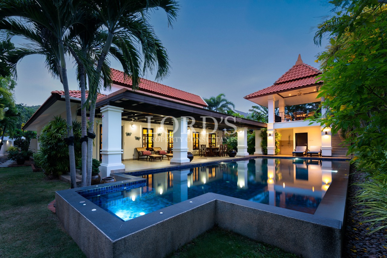 Luxury villa with illuminated swimming pool