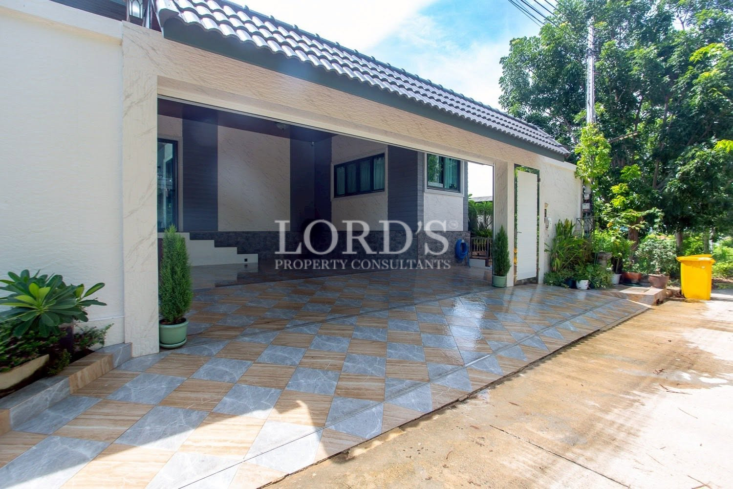 Villa entrance with covered carport