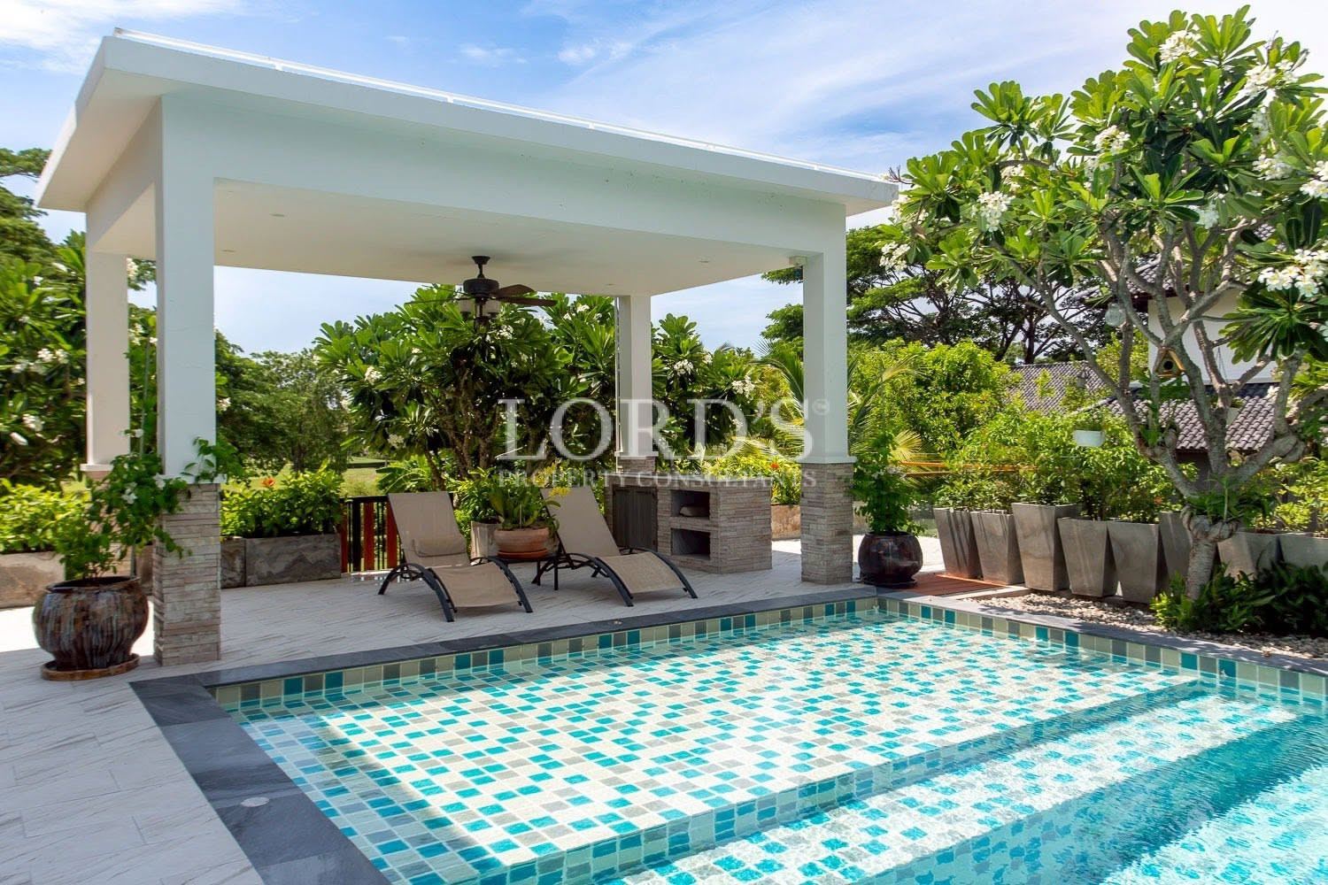 Covered terrace overlooking swimming pool