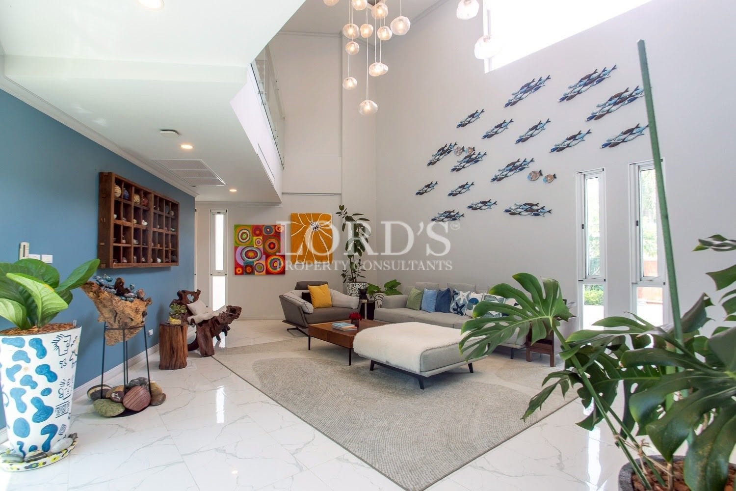 Open-plan living room with designer lighting