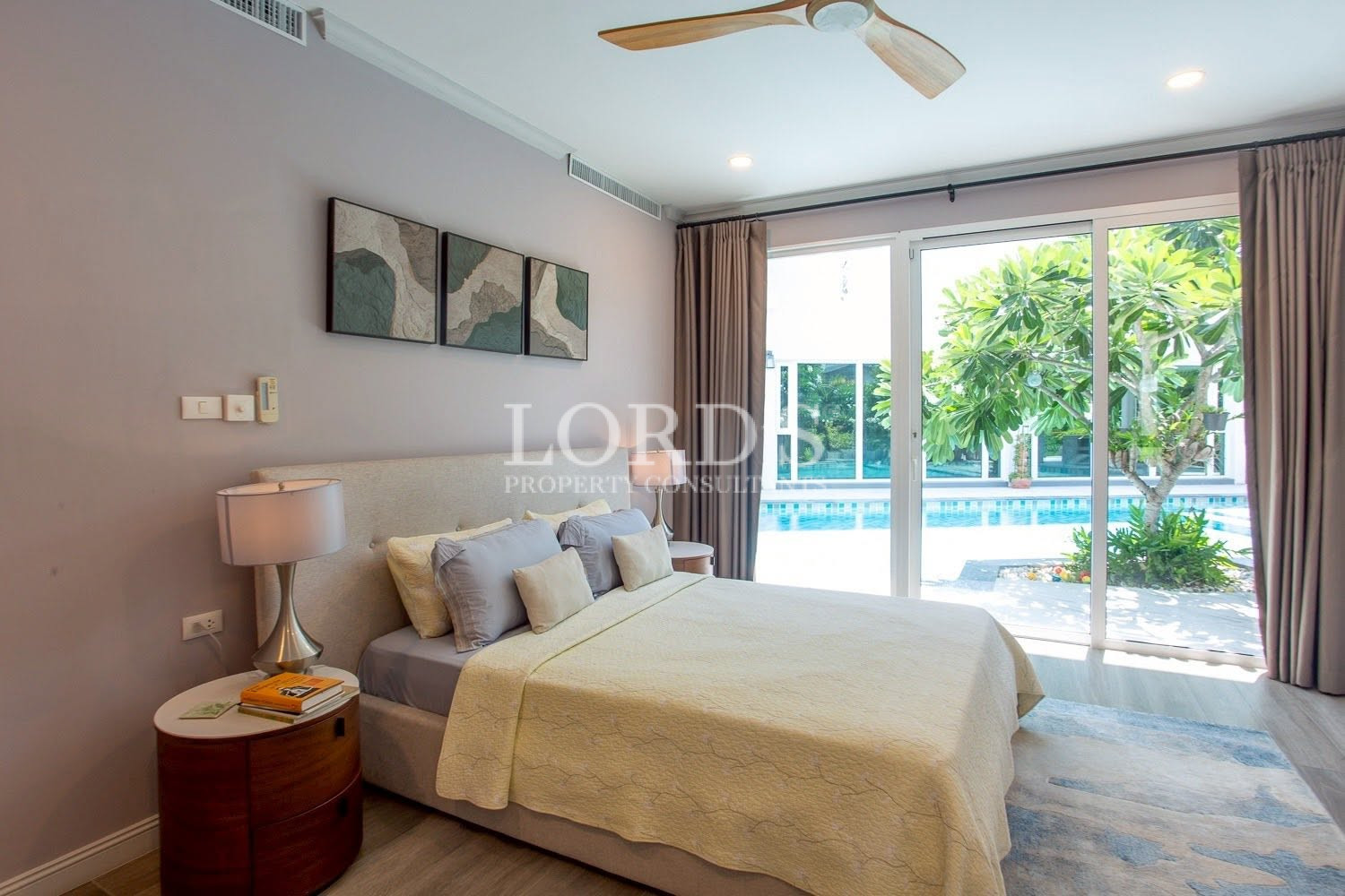 Bedroom with pool view and modern decor