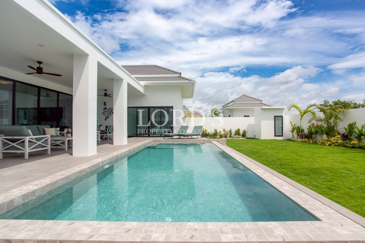 Modern villa courtyard with paved driveway
