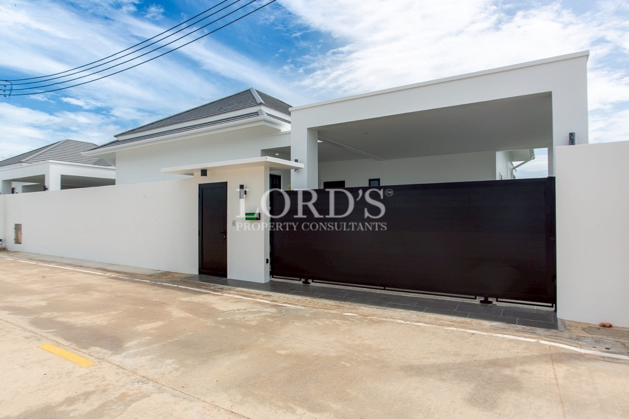 Modern villa exterior with covered driveway