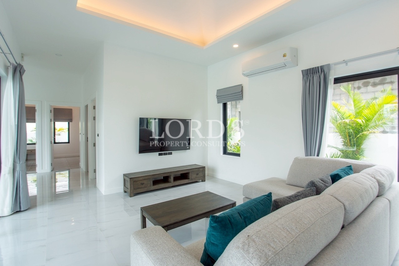 Bedroom with TV and balcony access
