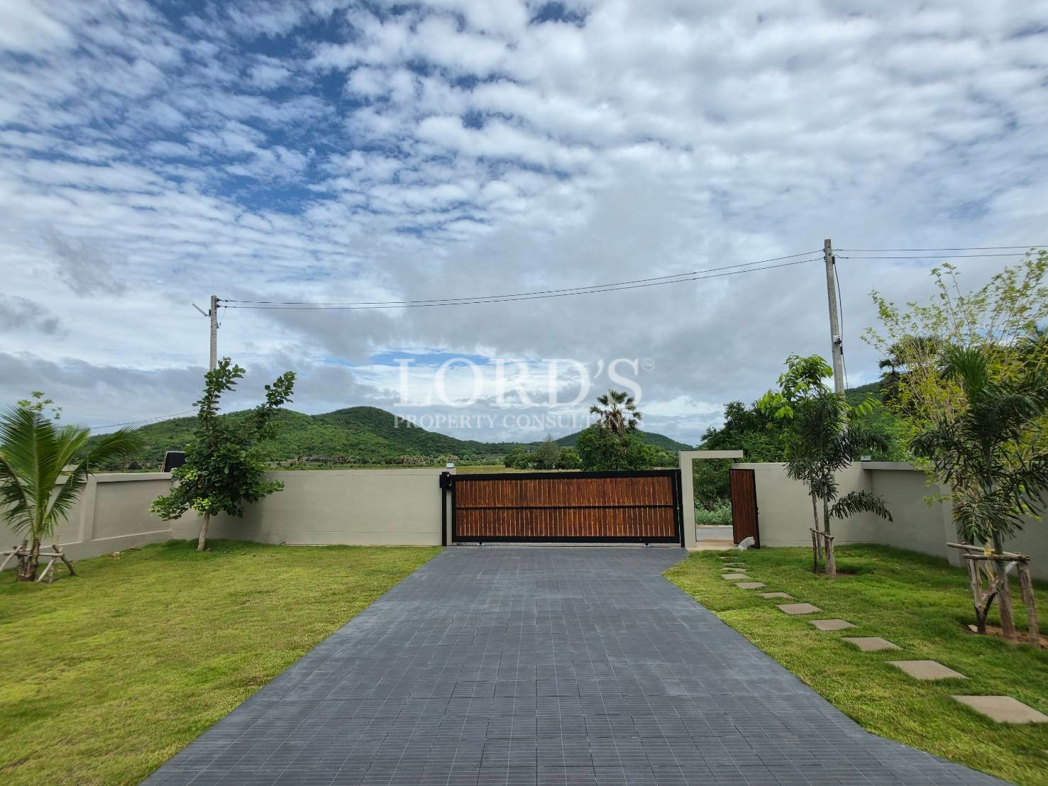 Landscaped lawn beside modern villa