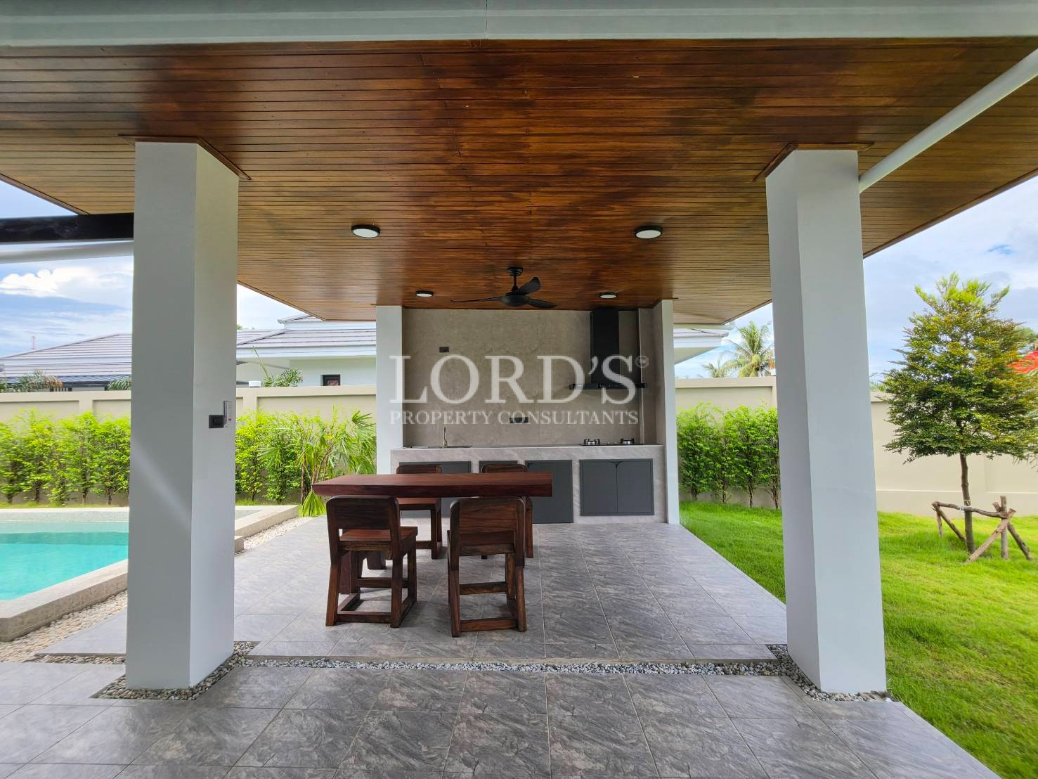 Covered outdoor terrace with wood ceiling