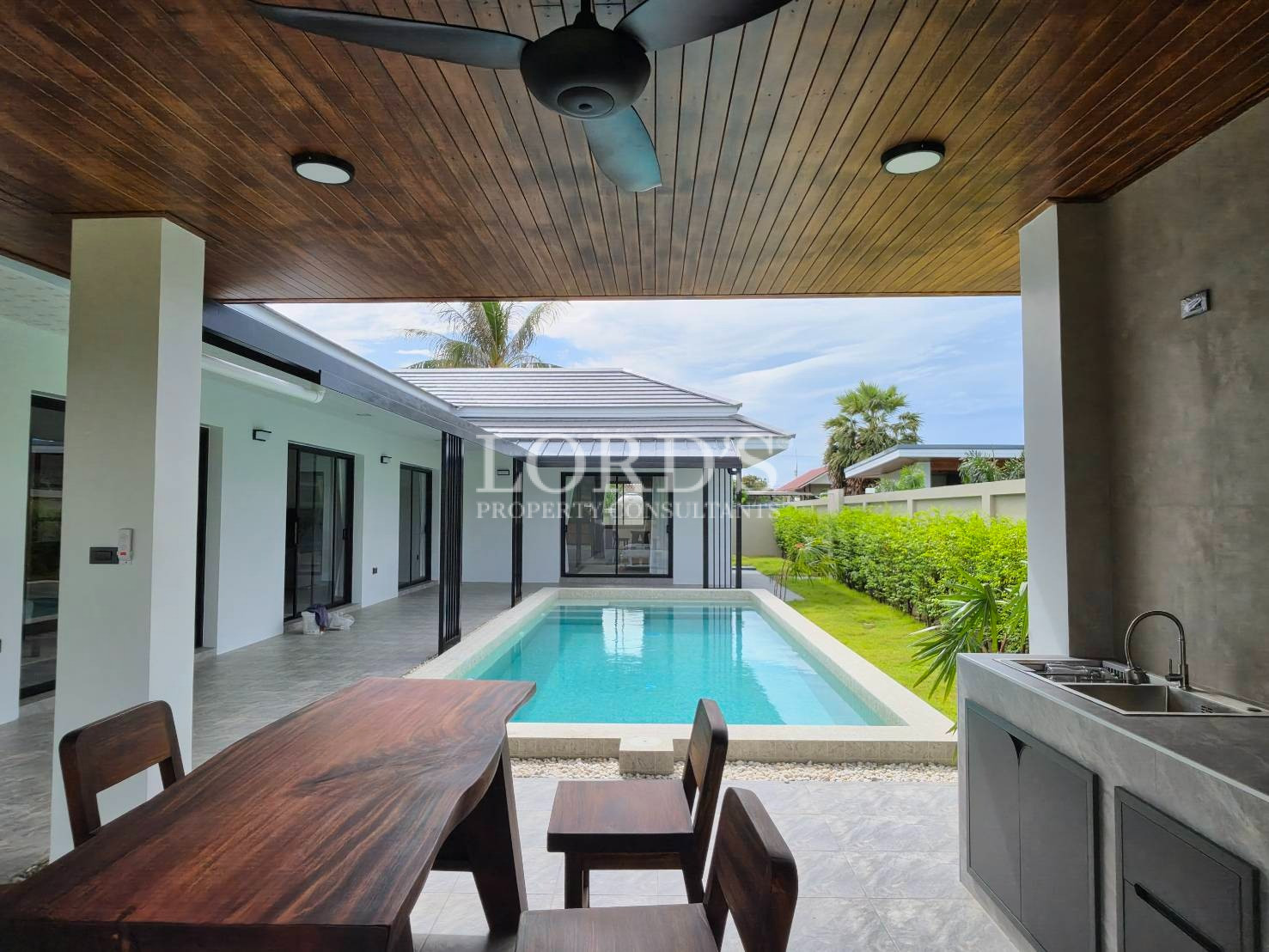 Covered outdoor terrace with ceiling fan