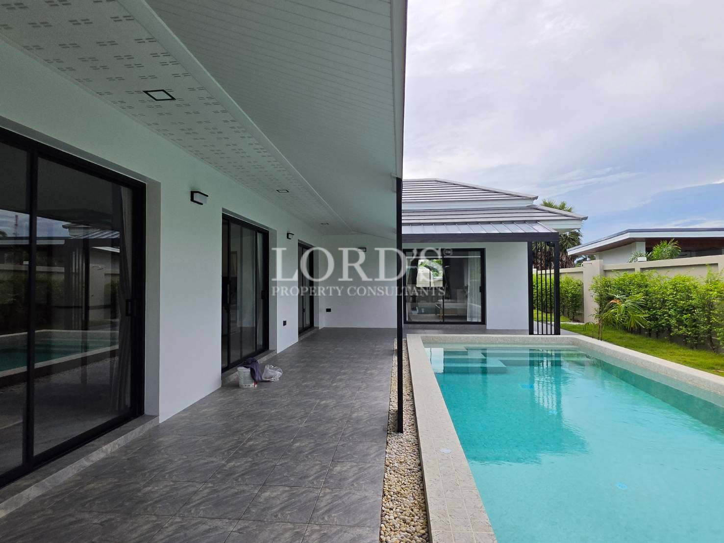 Covered patio overlooking pool area