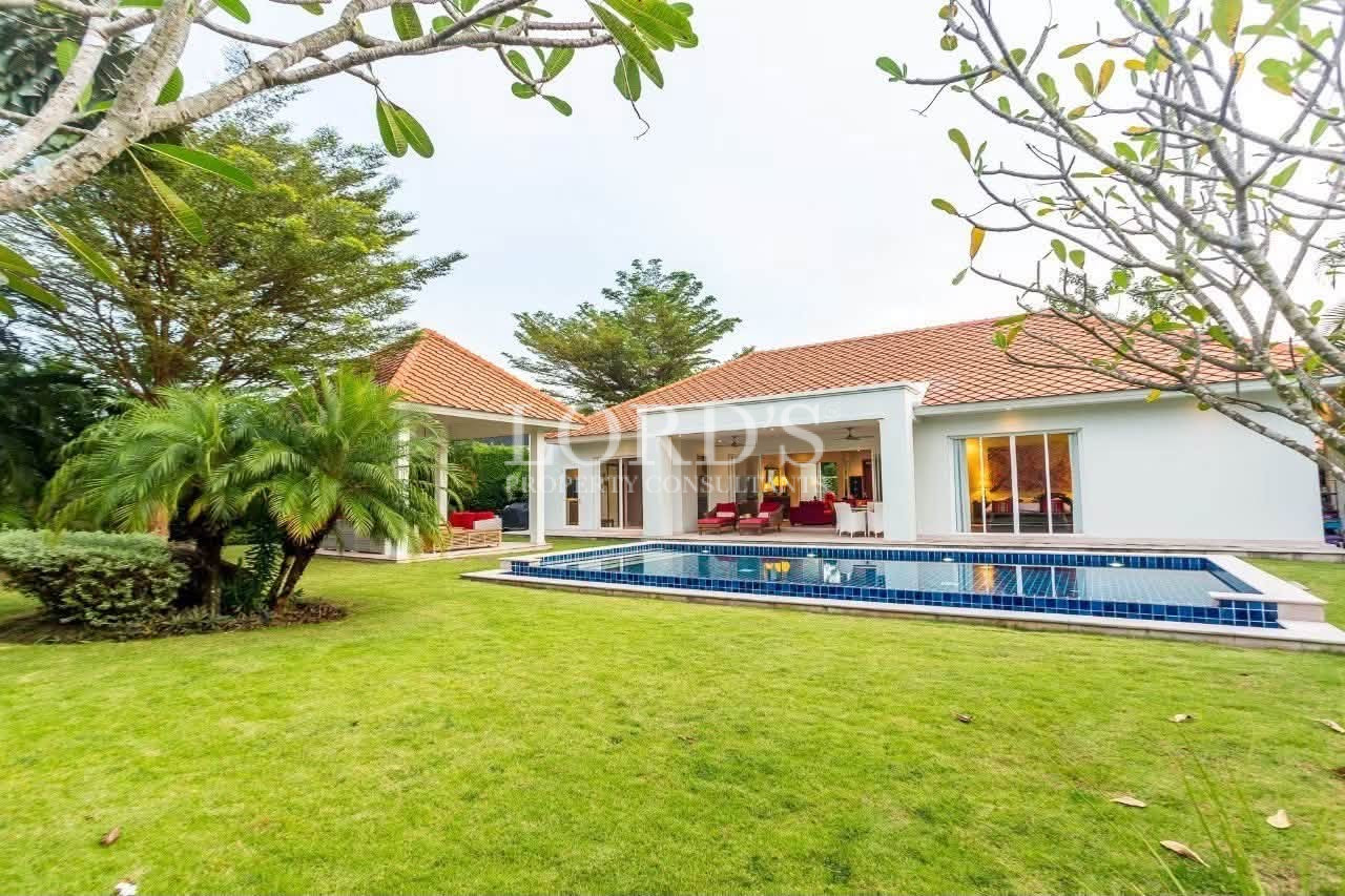 Contemporary villa with landscaped front lawn