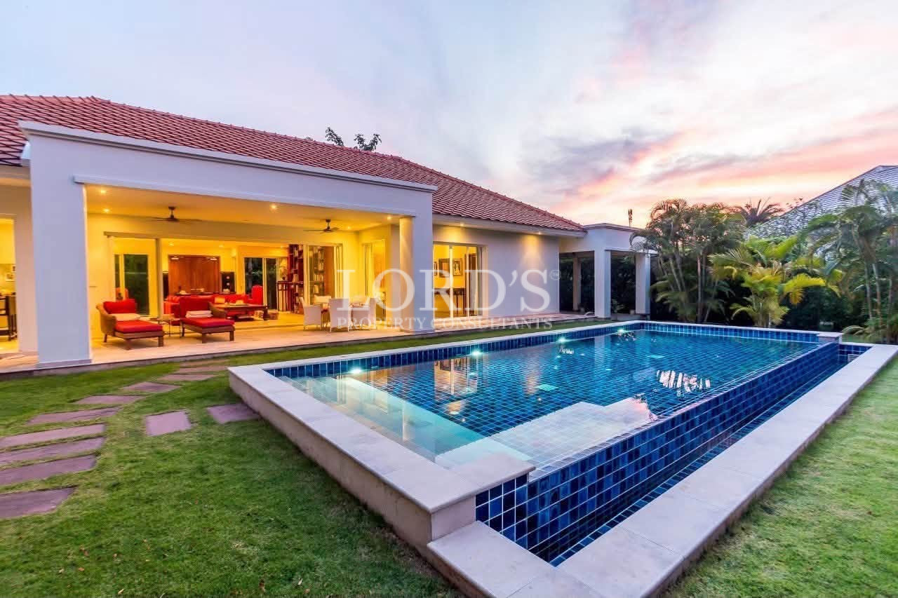 Modern villa with illuminated swimming pool