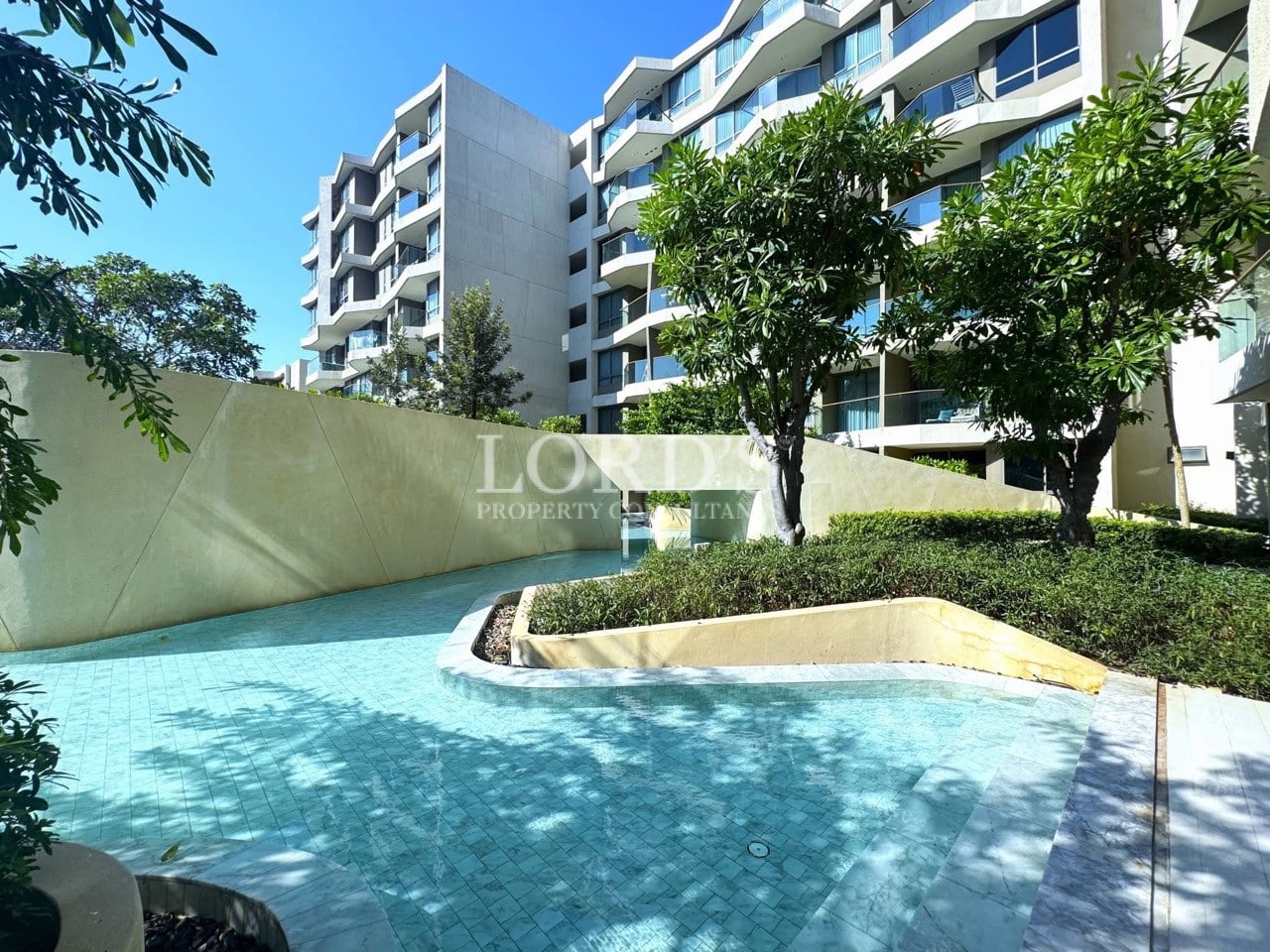 Modern apartment complex with swimming pool