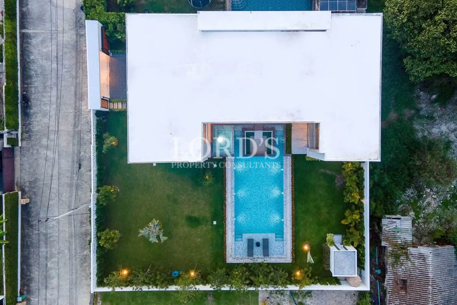 Top-down aerial view of villa and swimming pool