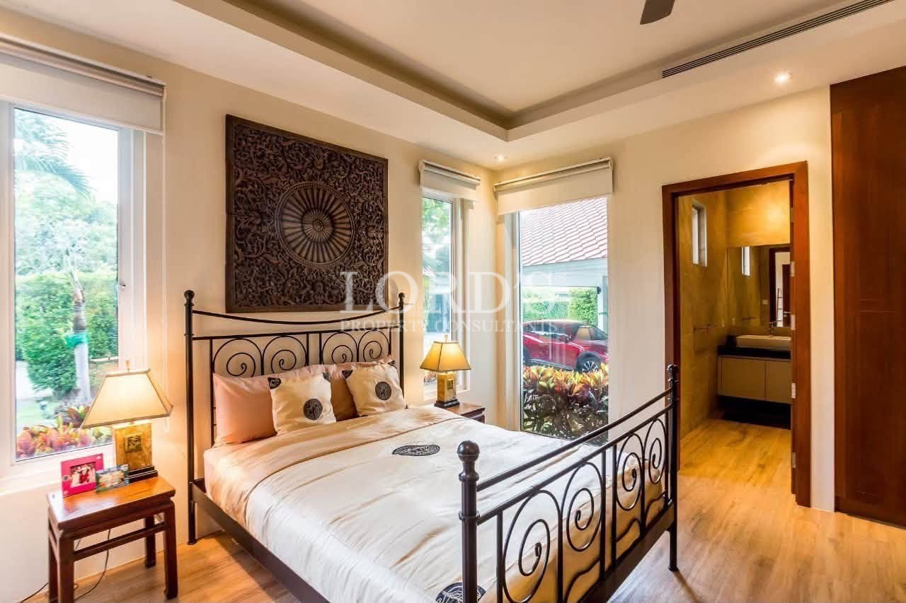 Contemporary bedroom with decorative headboard