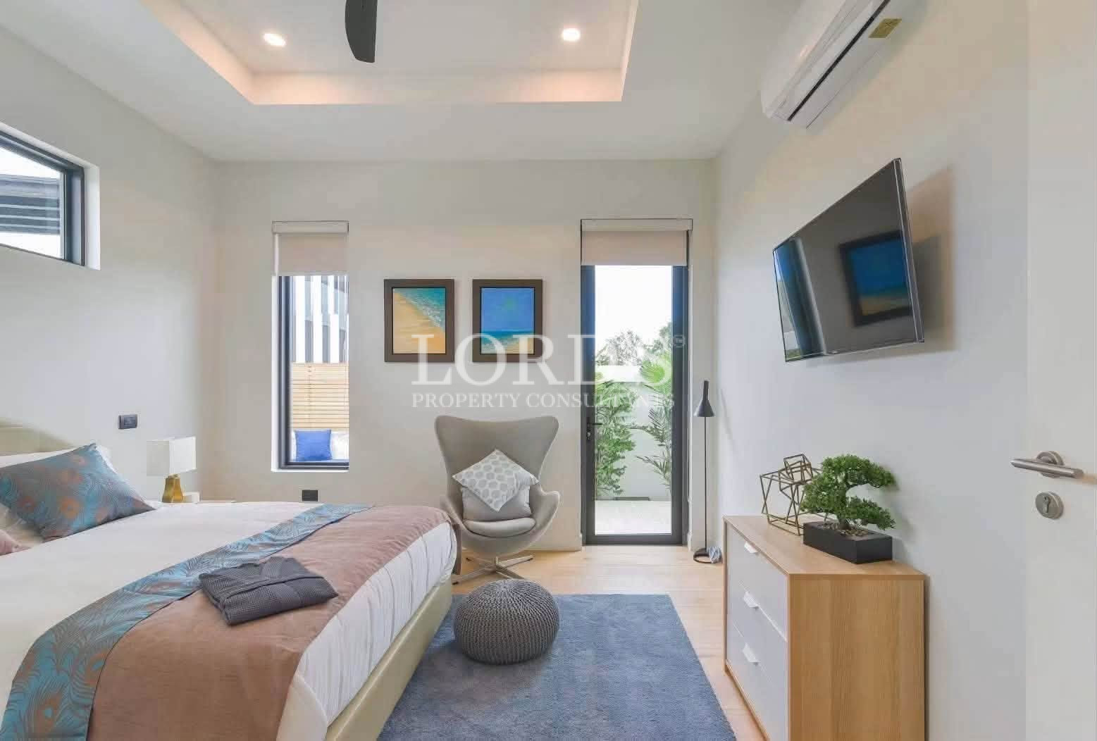 Minimalist bedroom with balcony access