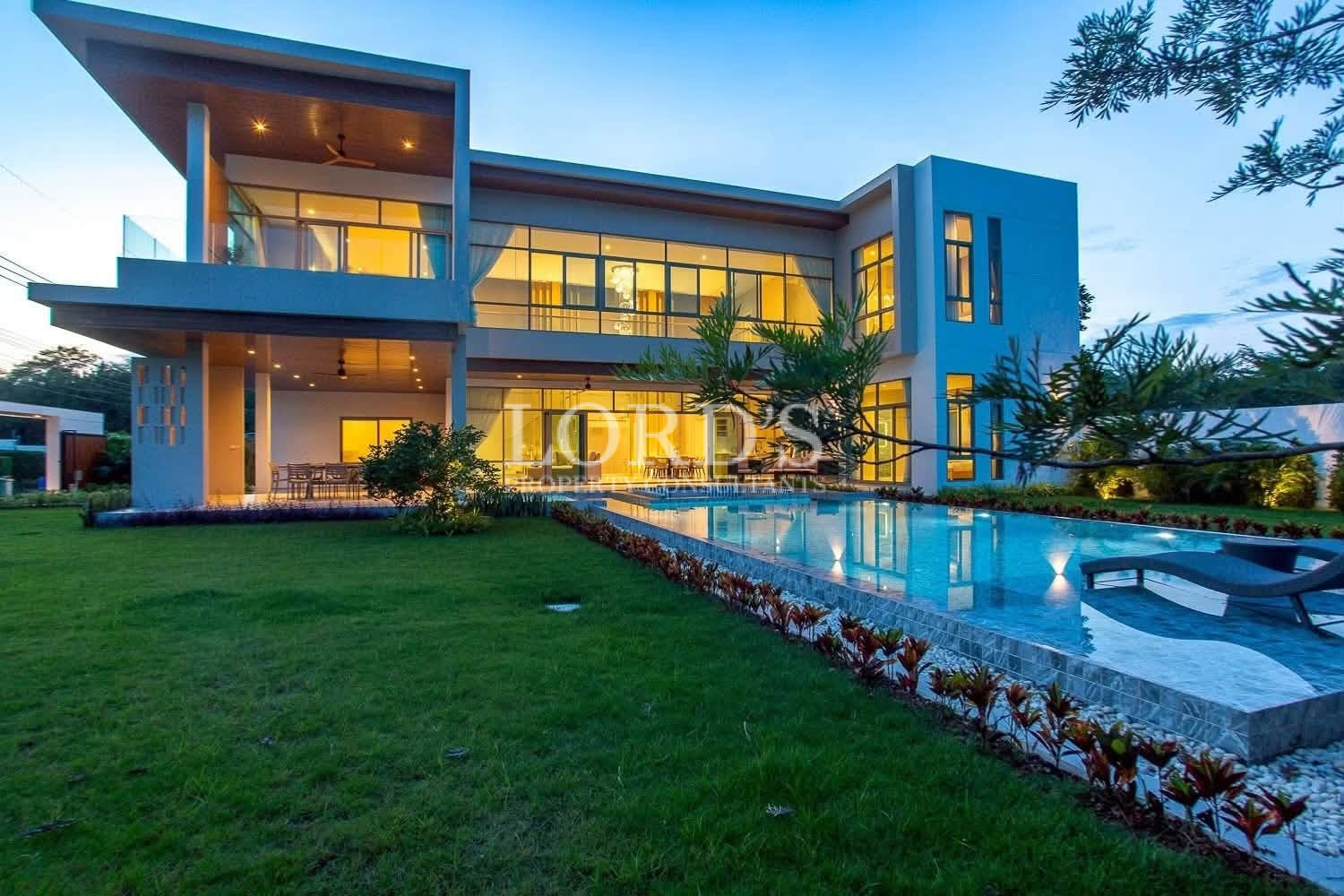 Luxury villa illuminated at dusk
