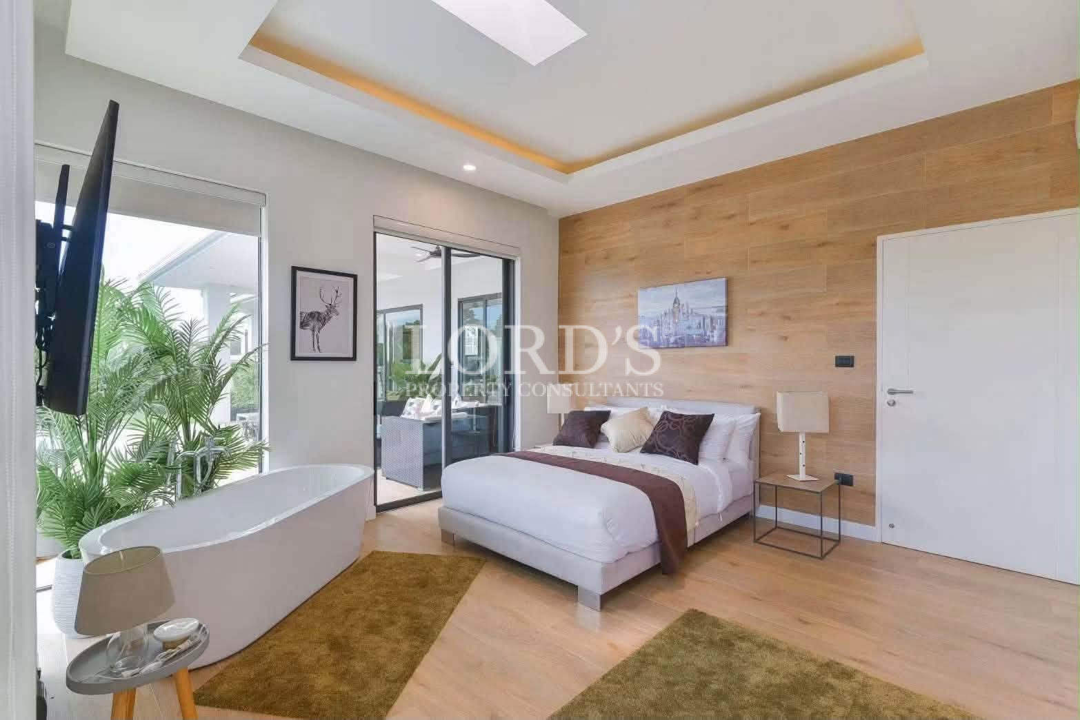 Contemporary bedroom with wood feature wall
