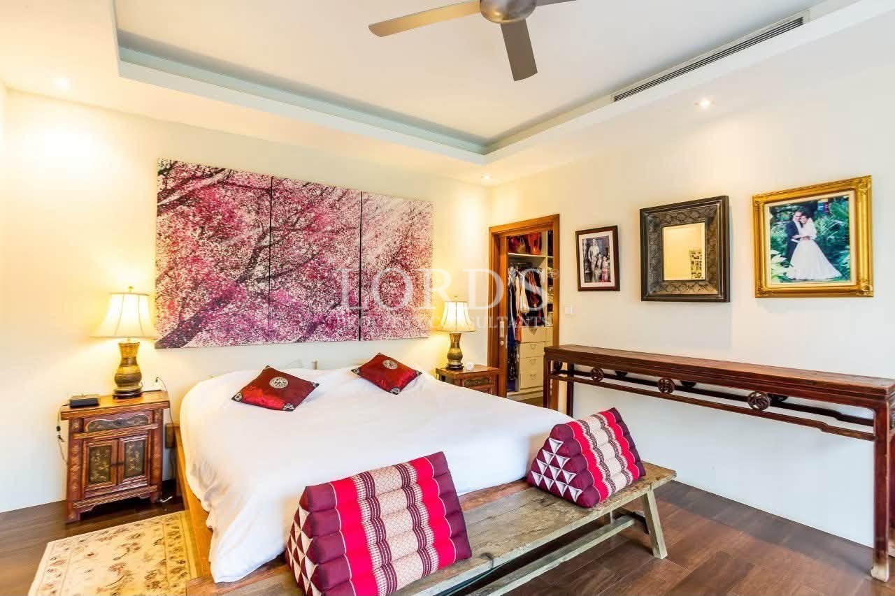 Bedroom with colorful feature artwork