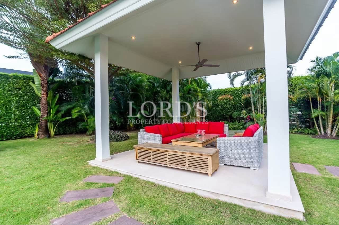 Outdoor lounge overlooking landscaped garden