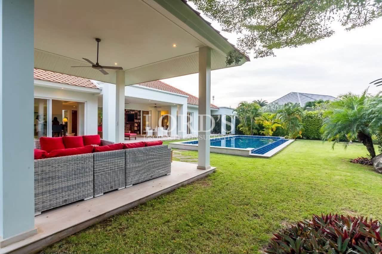 Covered outdoor terrace with lounge area
