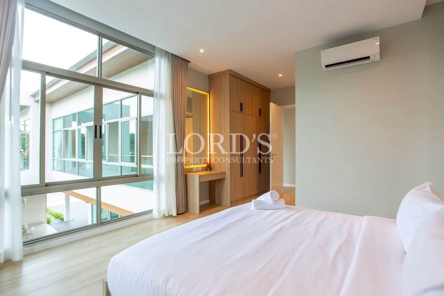 Bedroom with balcony and sliding glass doors