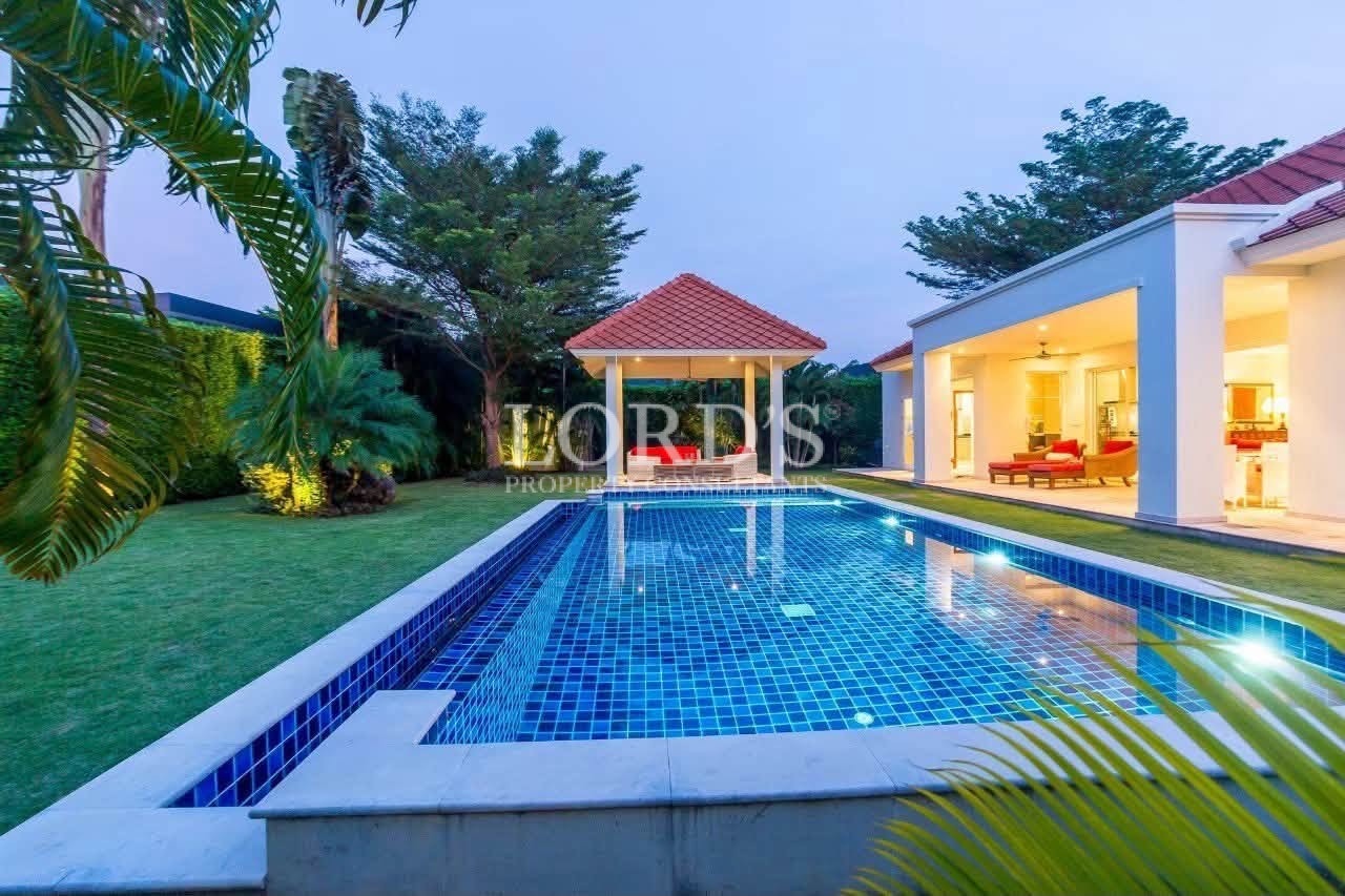 Modern villa with illuminated swimming pool