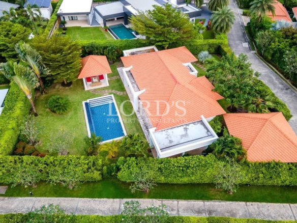 Drone view of modern villa with swimming pool