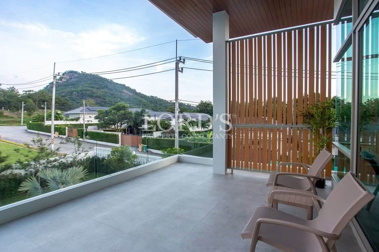 Covered entrance with wooden privacy screen