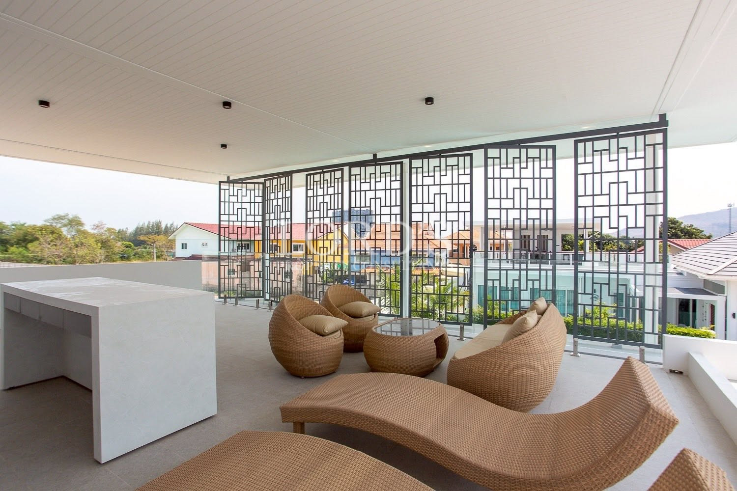 Open-plan living area with decorative screen