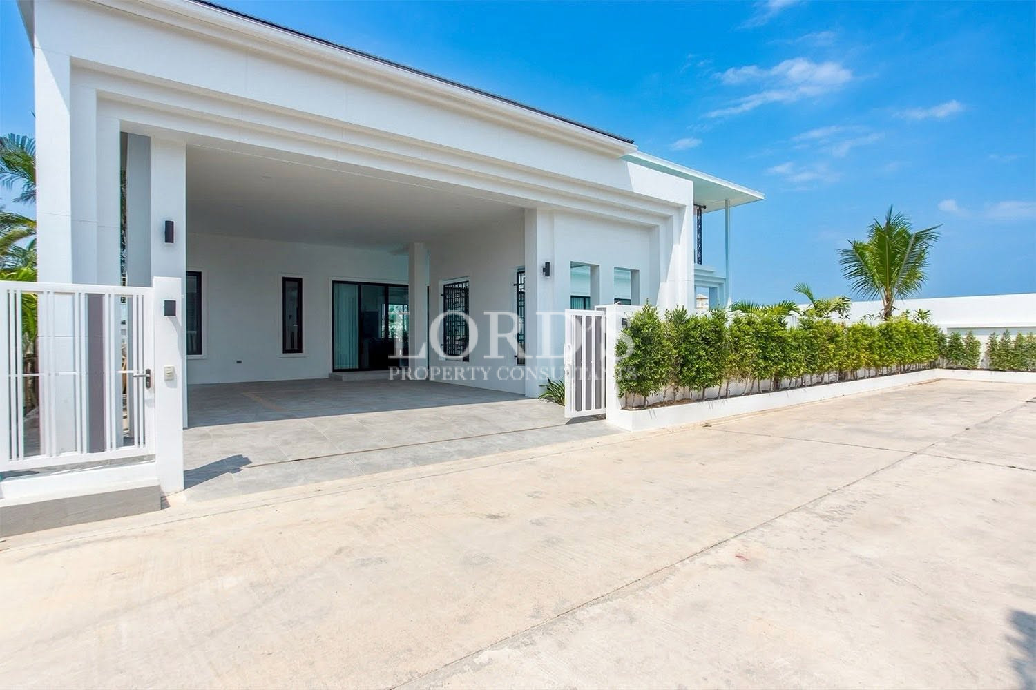 Contemporary villa exterior with covered terrace