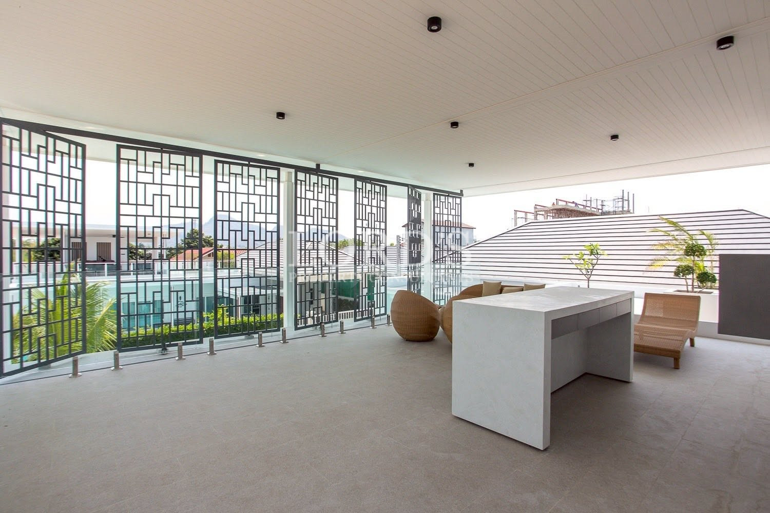 Open-plan living room with large windows