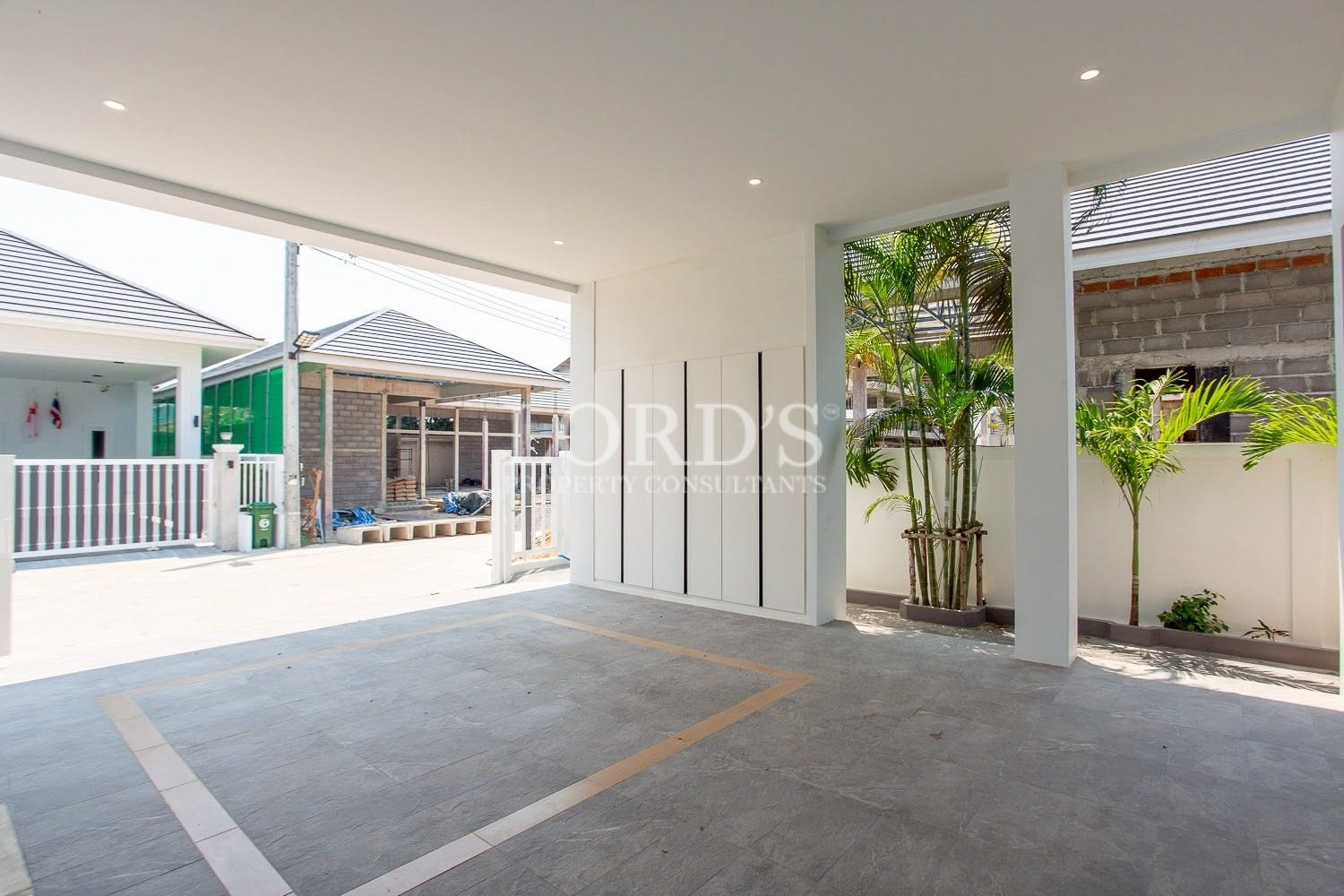 Covered courtyard with tropical landscaping