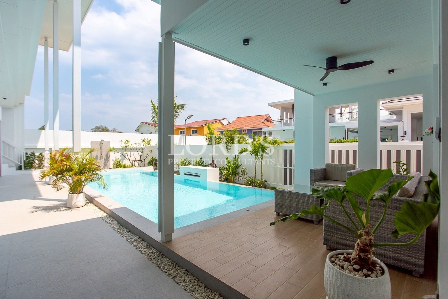 Covered outdoor terrace with ceiling fan