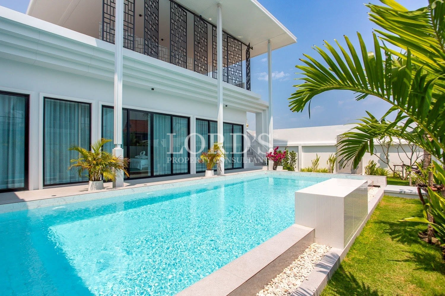 Two-story villa with balcony and garden