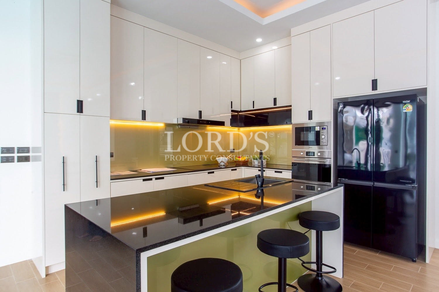 Modern kitchen with illuminated backsplash
