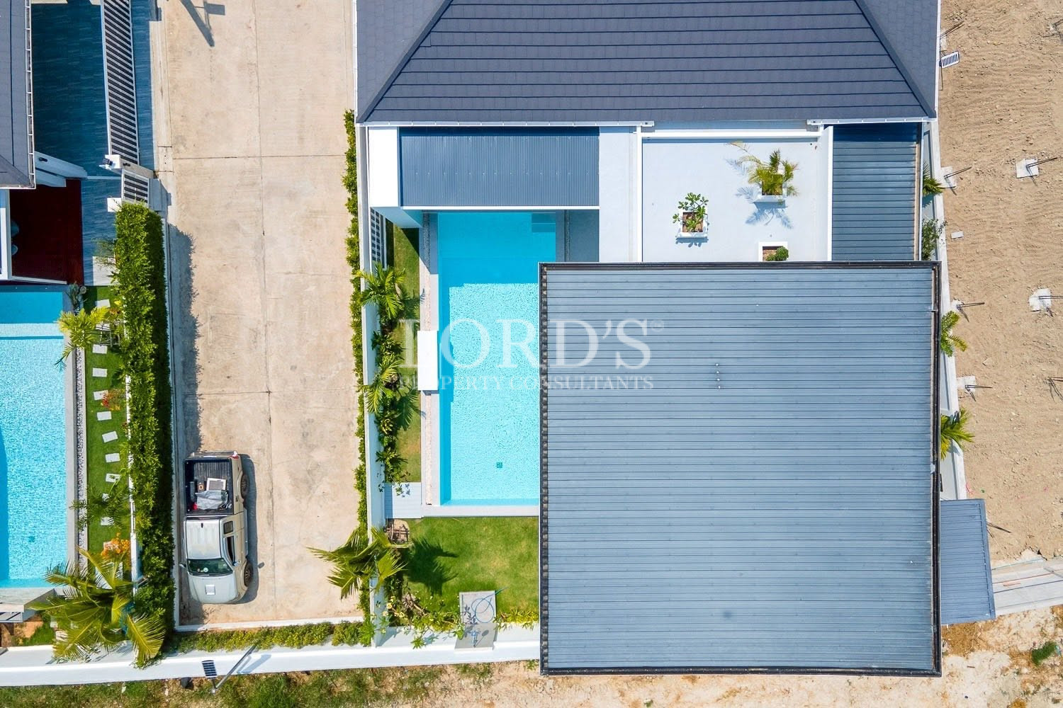 Modern villa entrance with covered carport