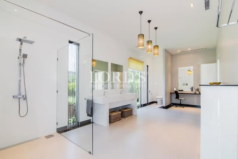 Contemporary bathroom with floating vanity and pendant lighting