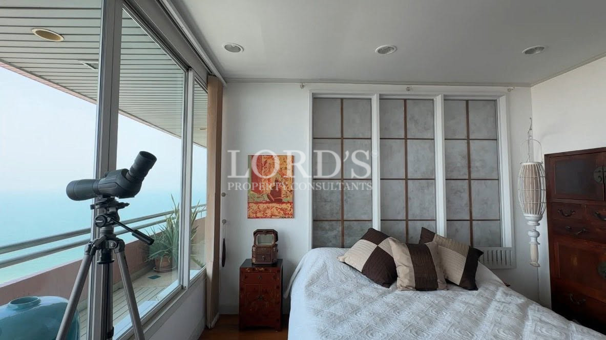 Spacious bedroom with modern wardrobe and minimalist design