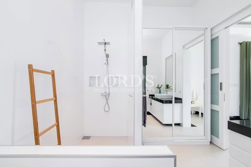 Bright minimalist bathroom with walk-in shower and modern finishes