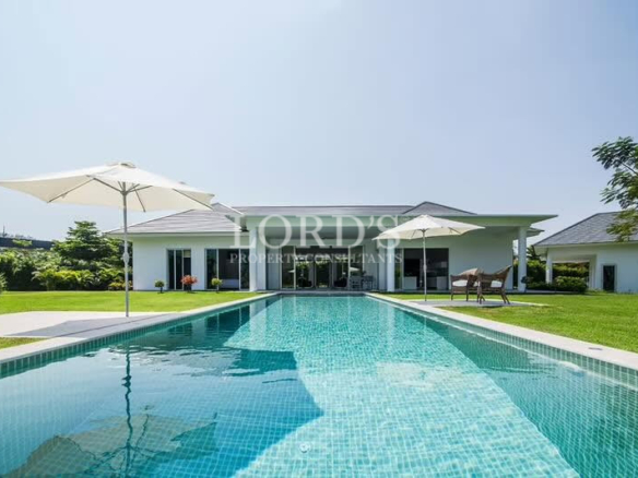 Luxury villa with landscaped lawn and spacious outdoor living area