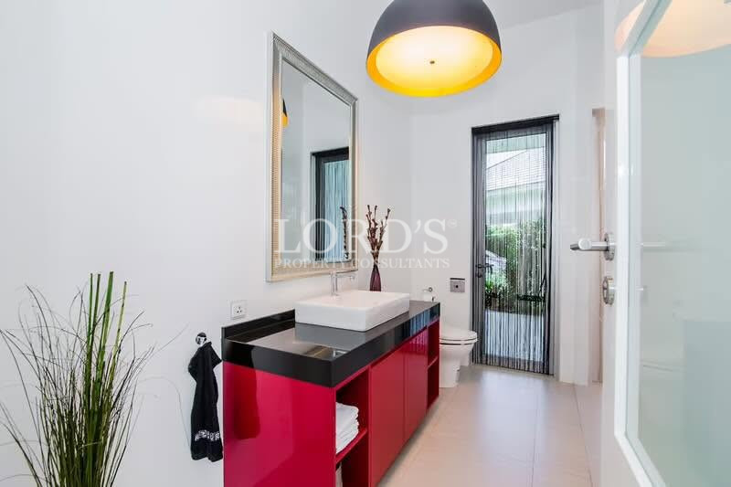 Stylish bathroom vanity with illuminated mirror and modern lighting
