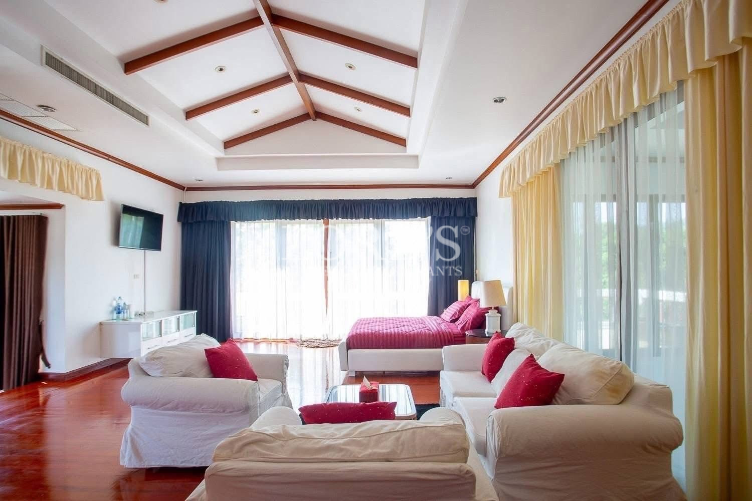 Bedroom with vaulted timber ceiling