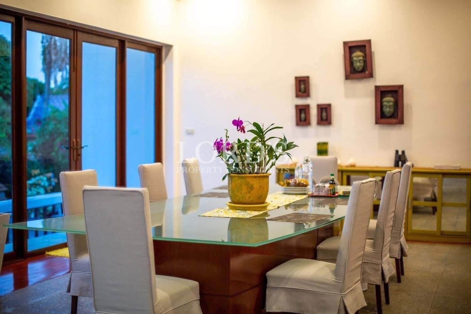 Cozy dining area with wooden furniture and decorative plants