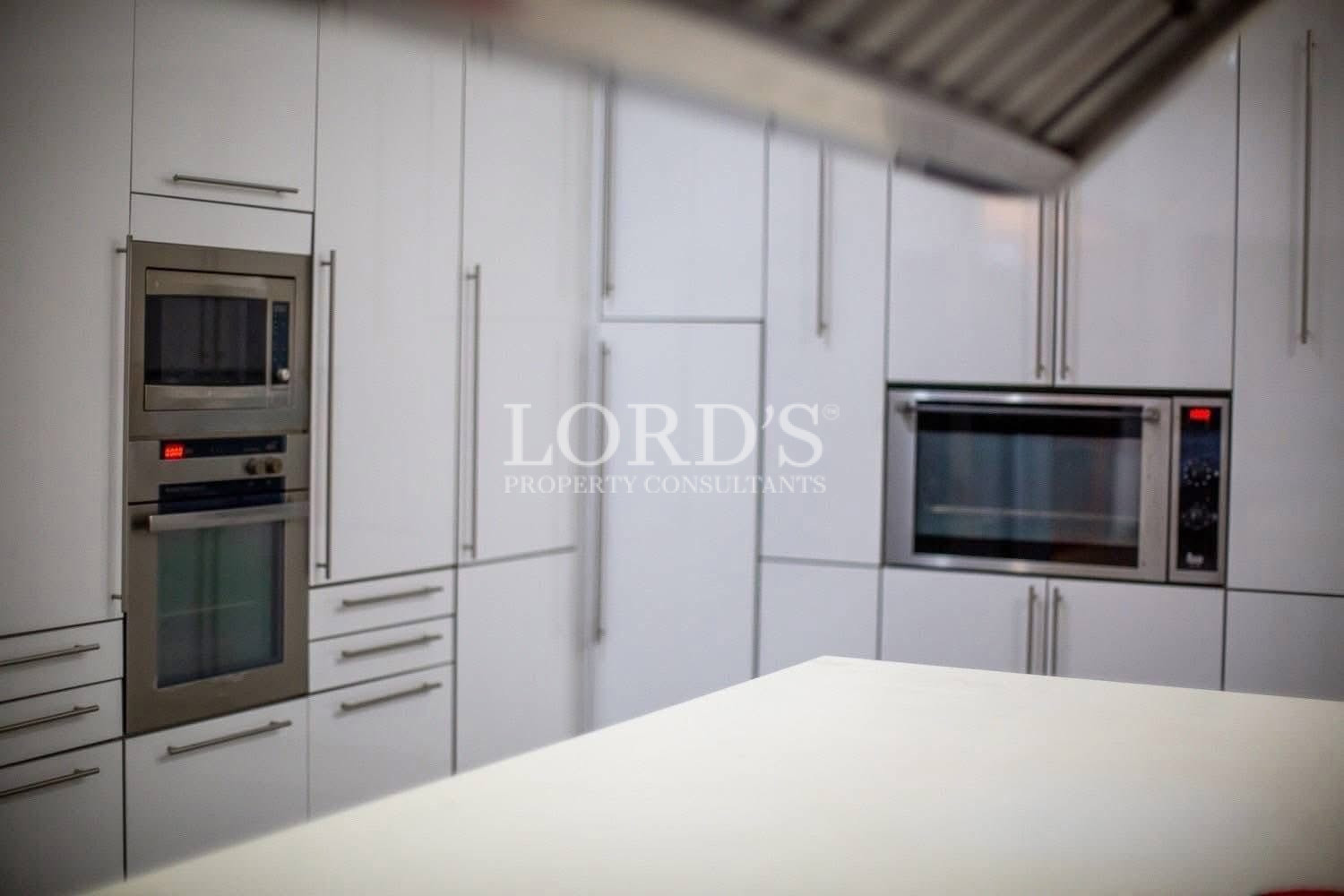 Modern kitchen with white cabinets and functional layout