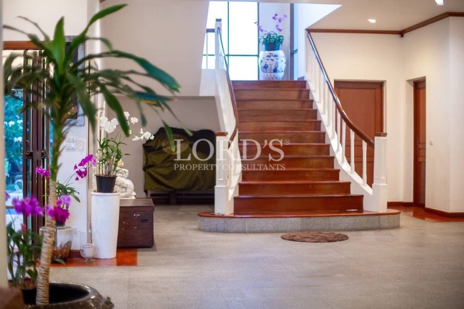 Modern wooden staircase with natural lighting inside a luxury home