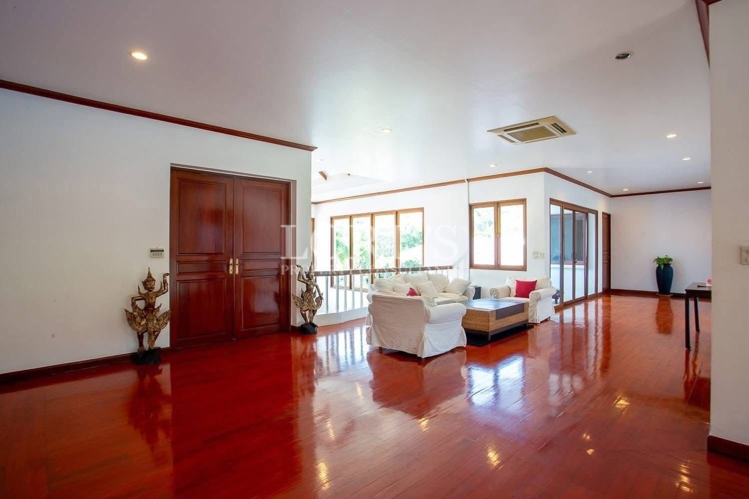 Residential entrance hall with wooden door and bright interior